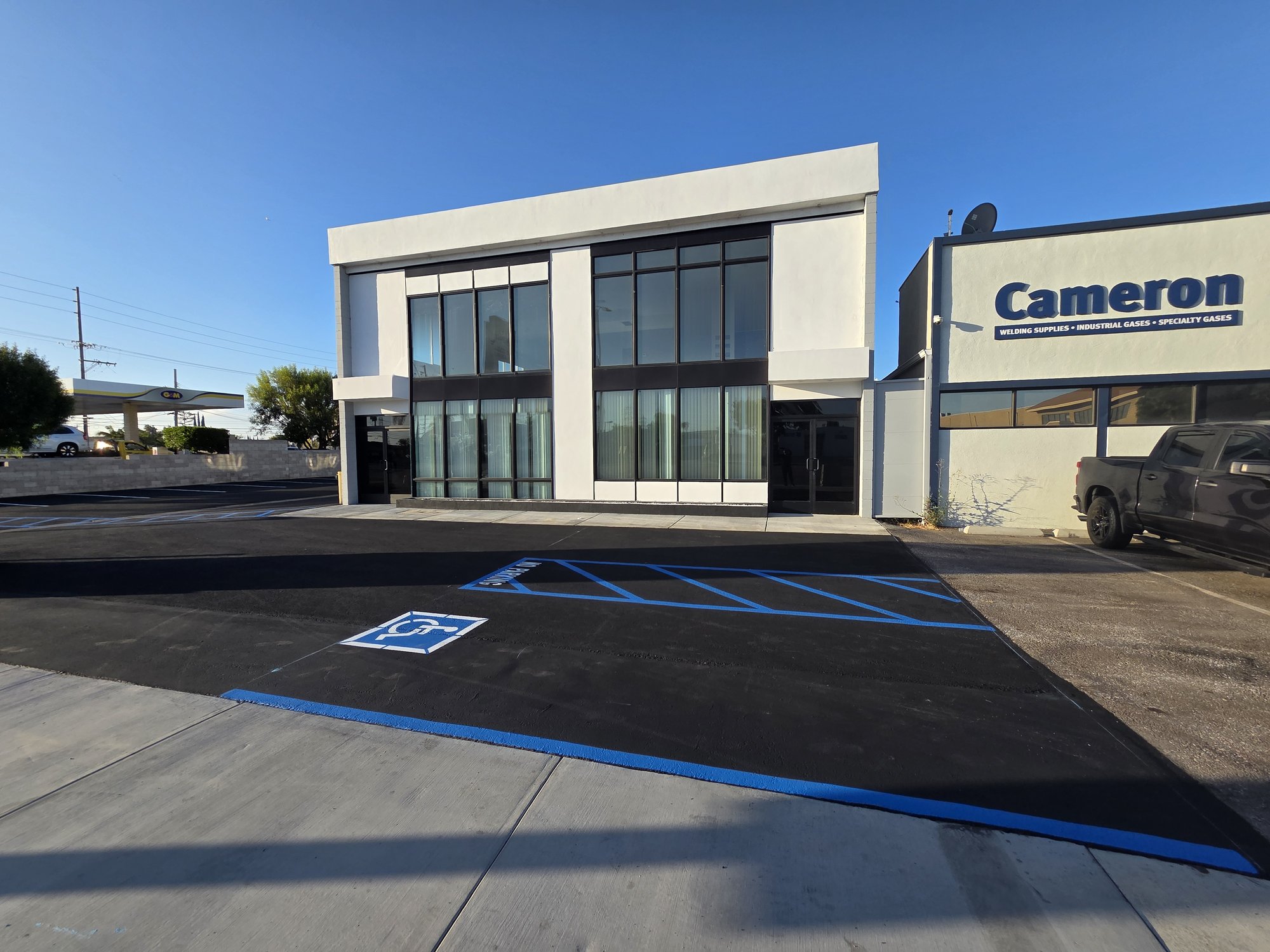 Commercial building face-lift with new asphalt and striping in Orange County